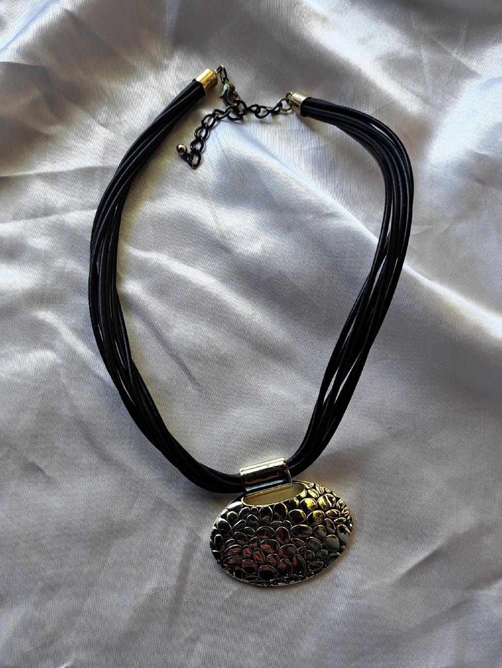 Black Multi-Strand Necklace with Textured Silver Pendant